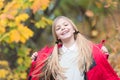 In her own style. Kid girl wear coat for autumn season nature background. Child cheerful on fall walk. Warm coat best Royalty Free Stock Photo