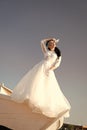 Her perfect day. Things consider for wedding abroad. Bride adorable white wedding dress sunny day posing on boat or ship