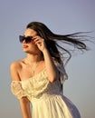 Her perfect style. Summer outdoor lifestyle. Happy young woman posing over blue sky. pretty young beautiful woman in Royalty Free Stock Photo