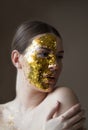 Her touch of gold is worth it Royalty Free Stock Photo