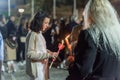 Heraklion, CRETE, GREECE - 28 APRIL 2019: People celebration with lit candles Easter night outside Agios Minas Cathedral