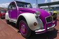 Heraklion, Crete / Greece. Image of a Vintage purple & white, four door convertible Citroen 2CV parked in Pancretan stadium for a