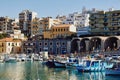 Heraklion, Crete, Greece, September 5, 2017: View of the old Venetian harbor, traditional architecture and boats Royalty Free Stock Photo