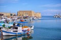 Heraklion, Crete - Greece. Traditional fishing boats in front of the fortress Koules castello a mare at the old port in Heraklio Royalty Free Stock Photo