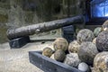 Fortress Koules Castello a Mare. Old rusty Venetian cannon and cannonballs