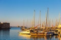 Old harbour of Heraklion with fishing boats and marina during twilight, Crete, Greece Royalty Free Stock Photo