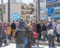 Heraklion, Greece - March 25, 2019: People on the square with greek flags