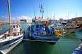 Heraklion, Greece, September 25, 2018, A fisherman sets up his fishing nets on his boat in the port Royalty Free Stock Photo