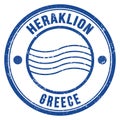 HERAKLION - GREECE, words written on light bue postal stamp Royalty Free Stock Photo