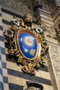Heraldic coat of arms at the entrance of the Duomo di Siena. Metropolitan Cathedral of Santa Maria Assunta. Italy.
