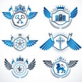 Heraldic emblems with wings isolated on white backdrop. Collection of vector symbols in vintage style created using heraldry elem Royalty Free Stock Photo