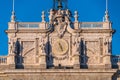 Heraldic shield, clock and bells detail of Royal Palace Palacio Real of Madrid, Spain.