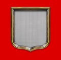 Heraldic shield diploma in wooden frame isolated on red Royalty Free Stock Photo
