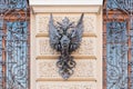 Heraldic symbol forged from iron on an old house in St. Petersburg