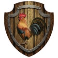Heraldic wooden shield with a rooster