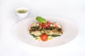 HERB CRUSTED HAMOUR FILLET with sauce served in dish isolated on table top view of arabic food