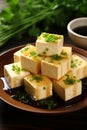 Herb-infused vegan tofu cheese adorned with flavorful sauce