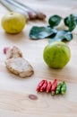 Herb ingredient of Tom Yum spicy soup Thai food cuisine on wooden background. Royalty Free Stock Photo