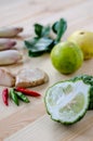 Herb ingredient of Tom Yum spicy soup Thai food cuisine on wooden background. Royalty Free Stock Photo