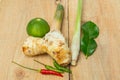 Herb ingredient of Tom Yum spicy soup Traditional Thai food cuisine on wood background Royalty Free Stock Photo