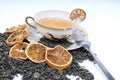 Herbal cup of tea with leaves and lemons Royalty Free Stock Photo