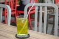 Herbal drink chrysanthemum tea with ice in a glass, placed on a brown wooden table Royalty Free Stock Photo