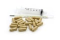 Herbal drug capsule and syringe Royalty Free Stock Photo