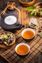 Herbal and fruit tea concept with teapot and infuser Royalty Free Stock Photo