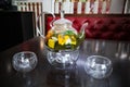 Herbal green tea in a transparent glass teapot and two glass cups on a wooden table Royalty Free Stock Photo