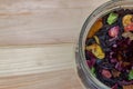 Herbal hour in a glass jar on a light wooden background. close up Royalty Free Stock Photo