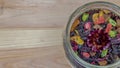 Herbal hour in a glass jar on a light wooden background. close up Royalty Free Stock Photo