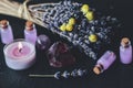 Herbal magick in wicca and witchcraft using lavender infused water. Purple candle, amethyst pyramid crystal, dried lavender flower