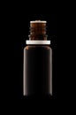 Herbal medicine or aromatherapy dropper bottle isolated on black Royalty Free Stock Photo