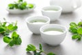 Herbal mint tea in small traditional chinese cups and fresh leaves