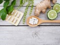 Herbal pills in wooden spoon and herbs Royalty Free Stock Photo