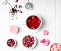 Herbal rose tea, dry roses and other pink colored objects