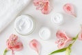 Herbal spa cosmetic cream with pink flowers hygienic skincare lotion Royalty Free Stock Photo