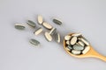 Herbal Supplement vitamin pills or tablets in wooden spoon Royalty Free Stock Photo