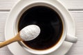 Herbal sweetener stevia in spoon and a cup of coffee Royalty Free Stock Photo