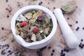 Herbal tea with blackberry in the white mortar Royalty Free Stock Photo