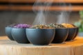 herbal tea blends, variety of herbal teas on rustic table, soft steam adding charm to the scene Royalty Free Stock Photo