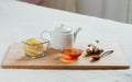 Herbal tea with chamomile flowers, turmeric and honey on a wooden board. Treatment of hot drink ginger. folk remedies Royalty Free Stock Photo