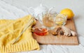 Herbal tea with chamomile flowers, turmeric and honey on a wooden board. Treatment of hot drink ginger. folk remedies Royalty Free Stock Photo