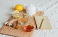 Herbal tea with chamomile flowers, turmeric and honey on a wooden board. Treatment of hot drink ginger. folk remedies Royalty Free Stock Photo