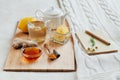 Herbal tea with chamomile flowers, turmeric and honey on a wooden board. Treatment of hot drink ginger. folk remedies Royalty Free Stock Photo