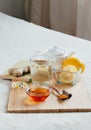 Herbal tea with chamomile flowers, turmeric and honey on a wooden board. Treatment of hot drink ginger. folk remedies Royalty Free Stock Photo