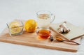 Herbal tea with chamomile flowers, turmeric and honey on a wooden board. Treatment of hot drink ginger. folk remedies Royalty Free Stock Photo