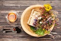 Herbal tea cup, healing herbs and honey in a wooden bowl on a wooden table. Royalty Free Stock Photo