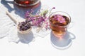 Herbal tea from fermented kipreya leaves in a glass Cup on a light background