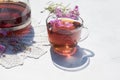 Herbal tea from fermented kipreya leaves in a glass Cup on a light background